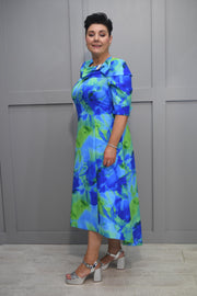 Cassandra Blue & Green Abstract Print Dipped Hem Dress With Bow & Brooch Detail- Martha B 923